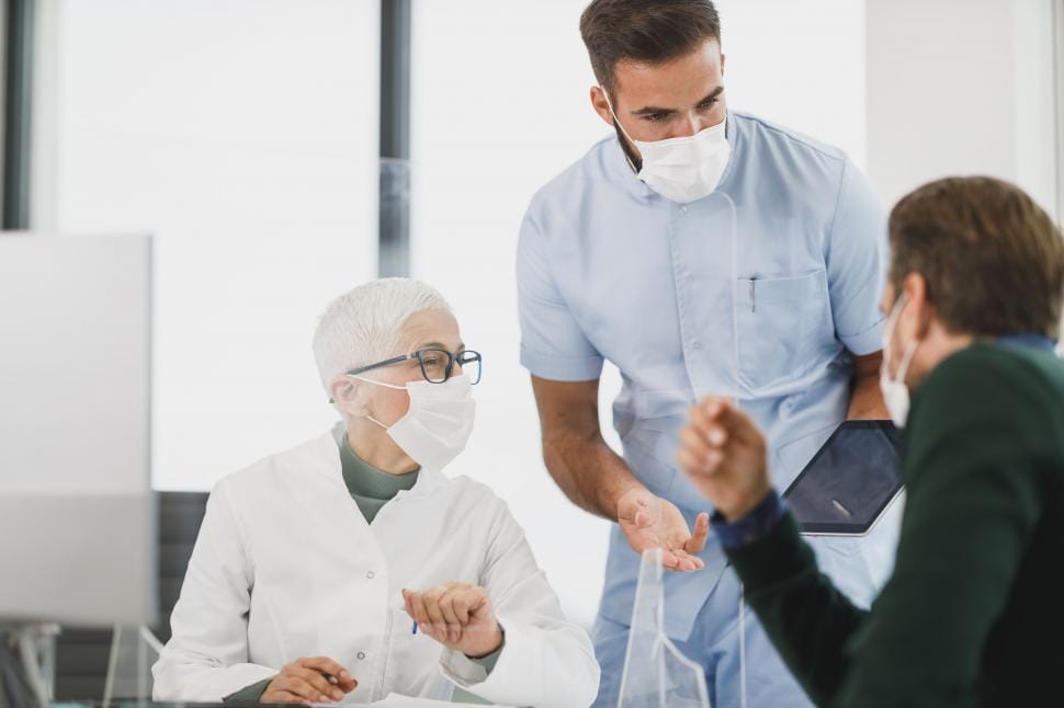 Healthcare provider speaking with a patient