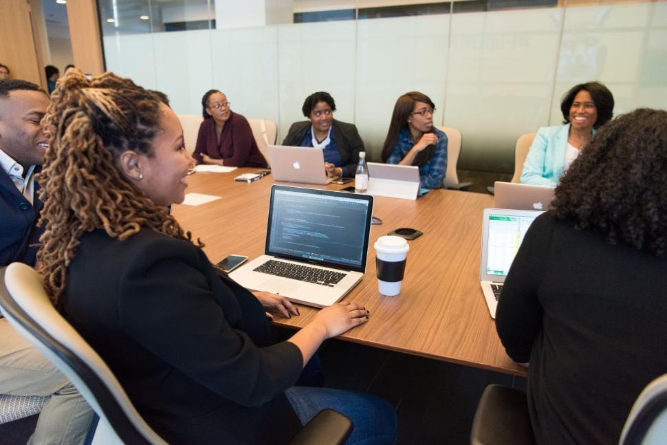 Diverse group of community leaders collaborating around a table